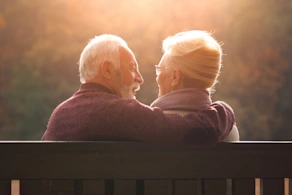 Life Assure Senior Couple Sitting On Bench In Autumn Park Blog